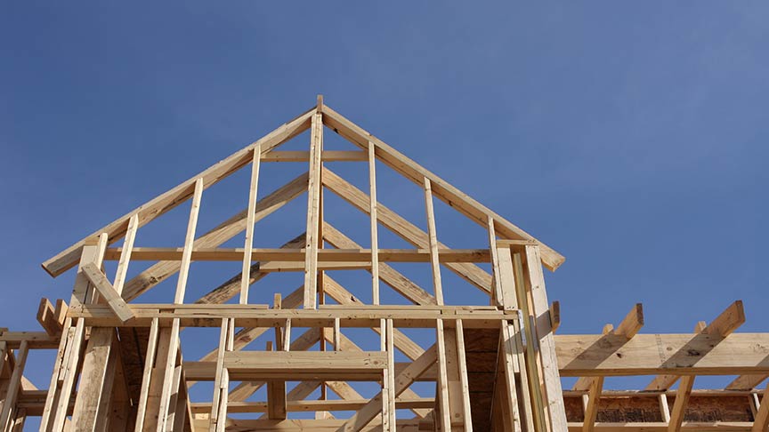 wooden frame of a house being built 